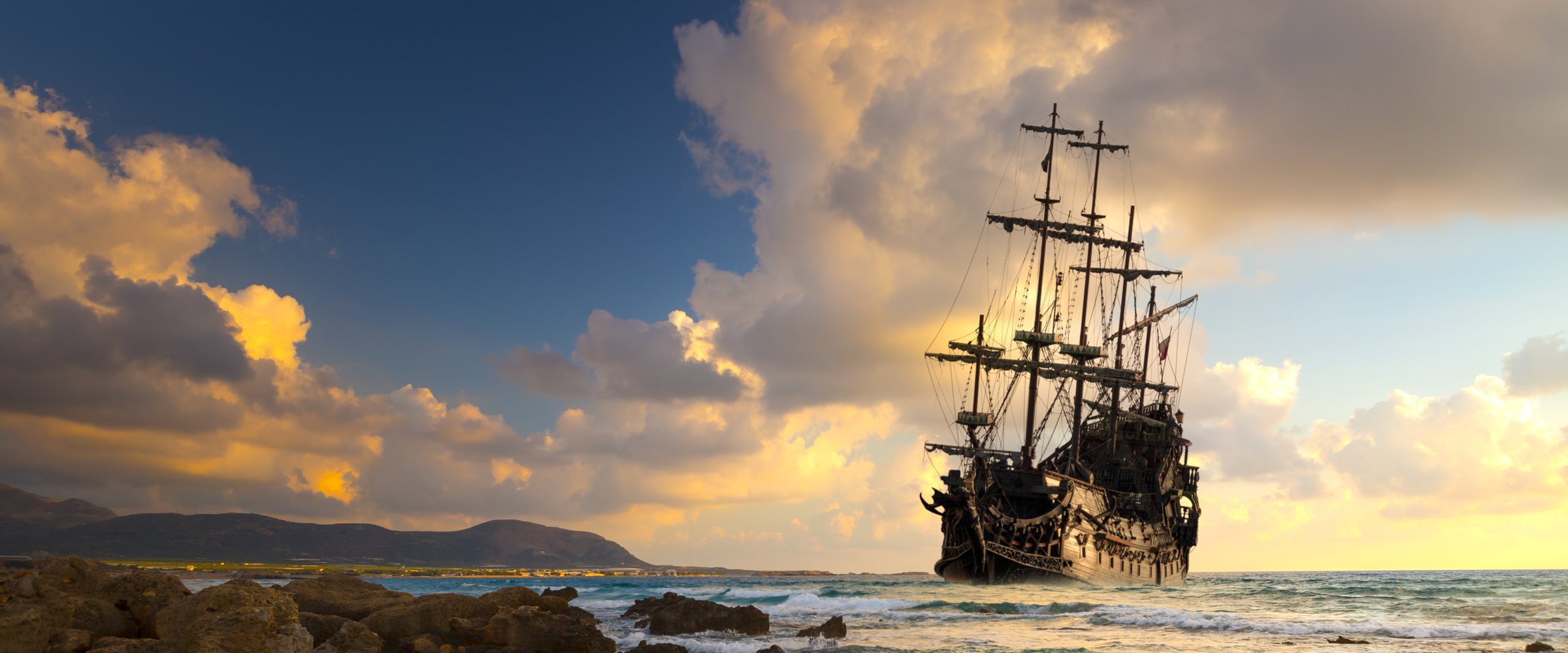 Old ship silhouette in sunset scenery, Italy