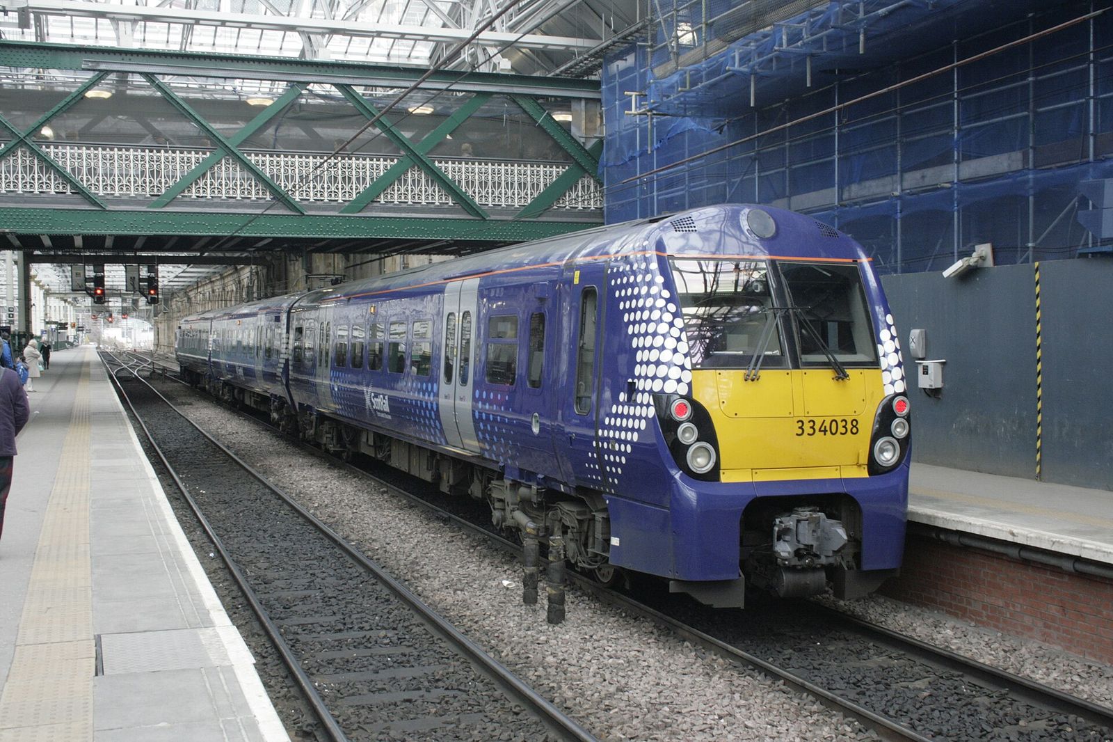 A ScotRail Saltire-liveried Class 334, no 334038, sits at Edinburgh Waverley having just completed a North Clyde Line run