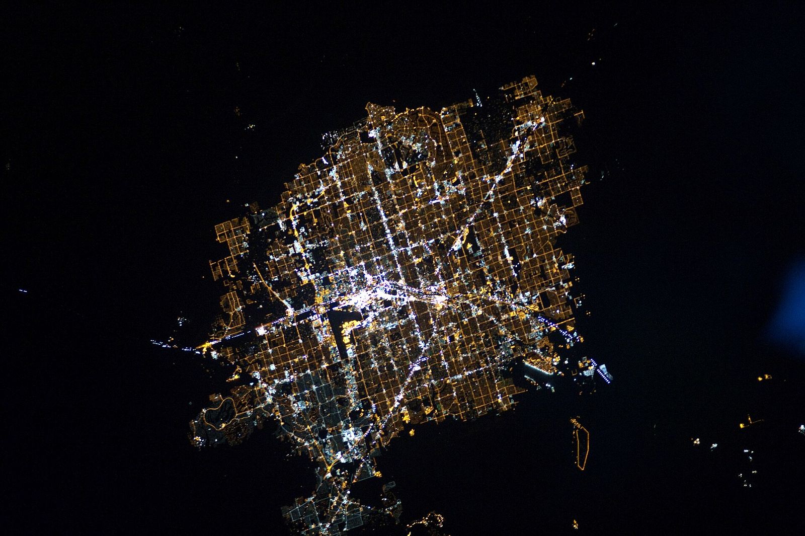 Las Vegas at night. (North is to the right of the picture.) The surrounding darkness of the desert presents a stark contrast