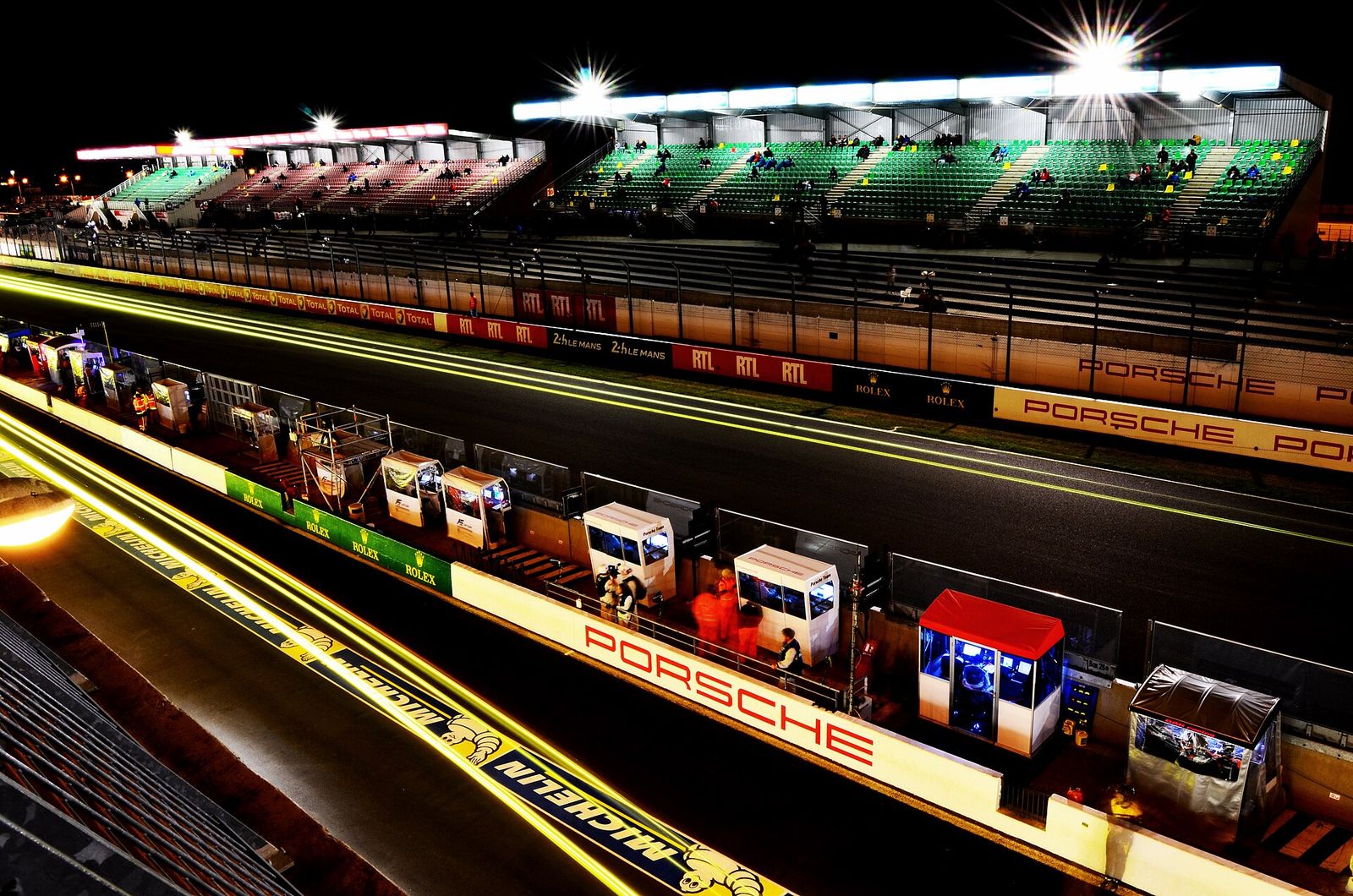 Pit lane and front stretch at night during the 2014 24 Hours of Le Mans