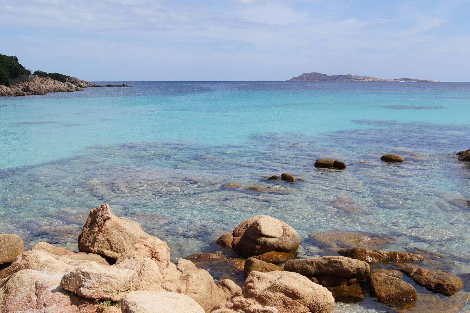 Play of colors of the water on the Sardinian beach, Costa Smeralda