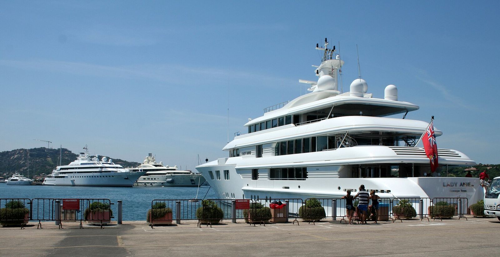 Three luxury yachts - Lady Anne, Lady Moura and Dilbar within the port of Porto Cervo, Costa Smeralda