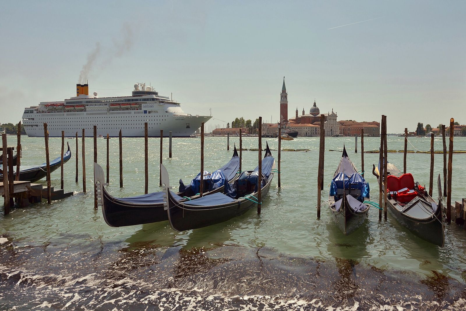 The cruiseship Costa neoClassica and gondolas in Venice