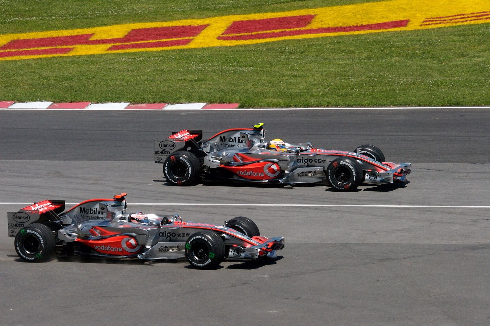 Lewis Hamilton leads into the first corner of the 2007 Canadian Grand Prix as Fernando Alonso runs wide