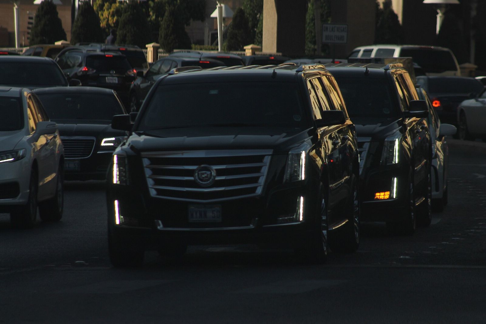 Two black fourth-generation Cadillac Escalades of the Wynn Las Vegas stopped at a light on Sands Avenue, COUTURE