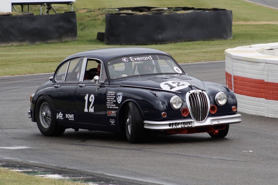 Grant Williams, a Welsh historic racing driver, driving his Jaguar MK2 “JAG 400” at the Goodwood Motor Circuit in May 2025, Goodwood Revival