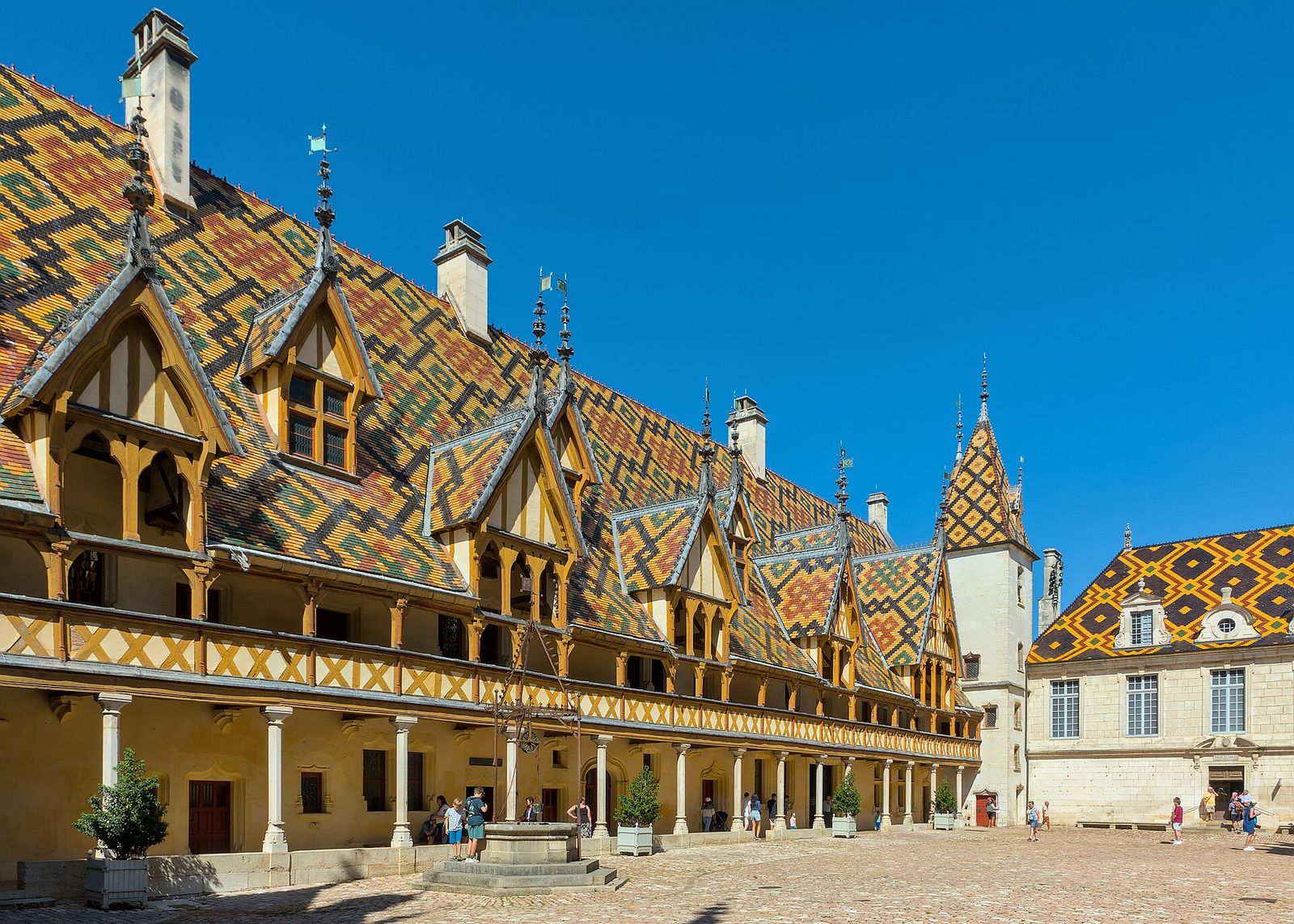 Beaune (Côte-d'Or, France) - Hôtel-Dieu (former hospital) - The courtyard, along the famous glazed tiles roof, Hospices de Beaune Wine Auction