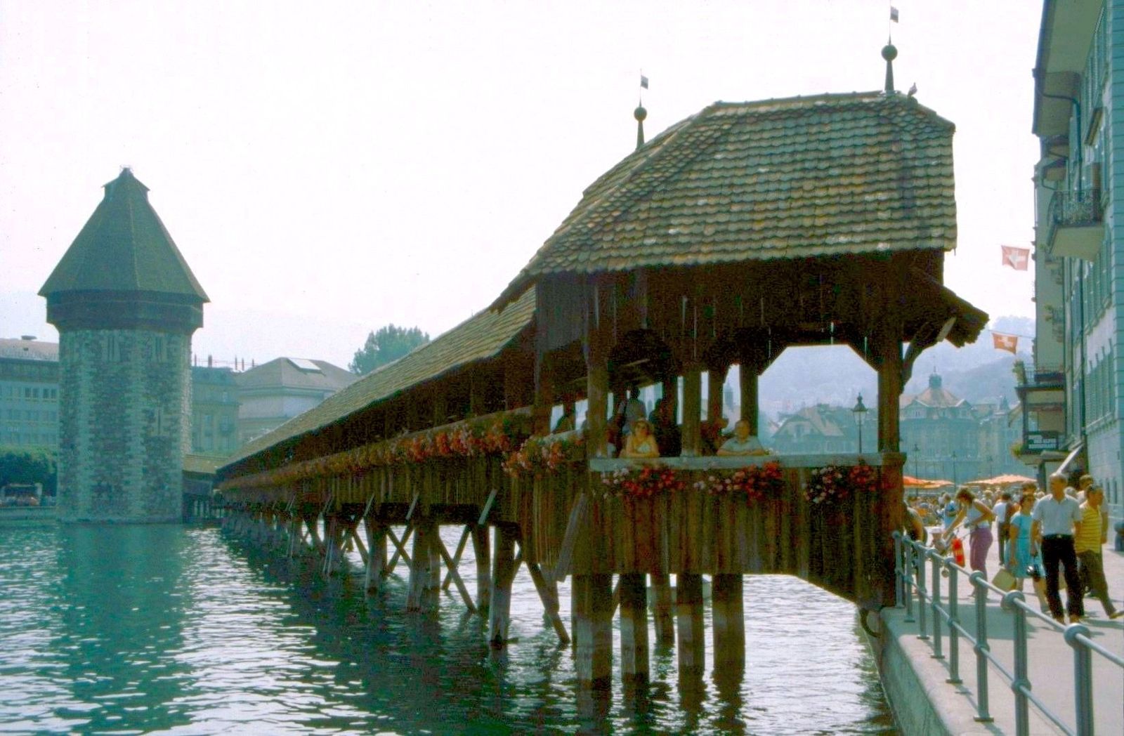 The bridge spans the Reuss River, which originates in the Gotthard Massif in the Canton of Uri, flows through Lake Lucerne, Lucerne Festival