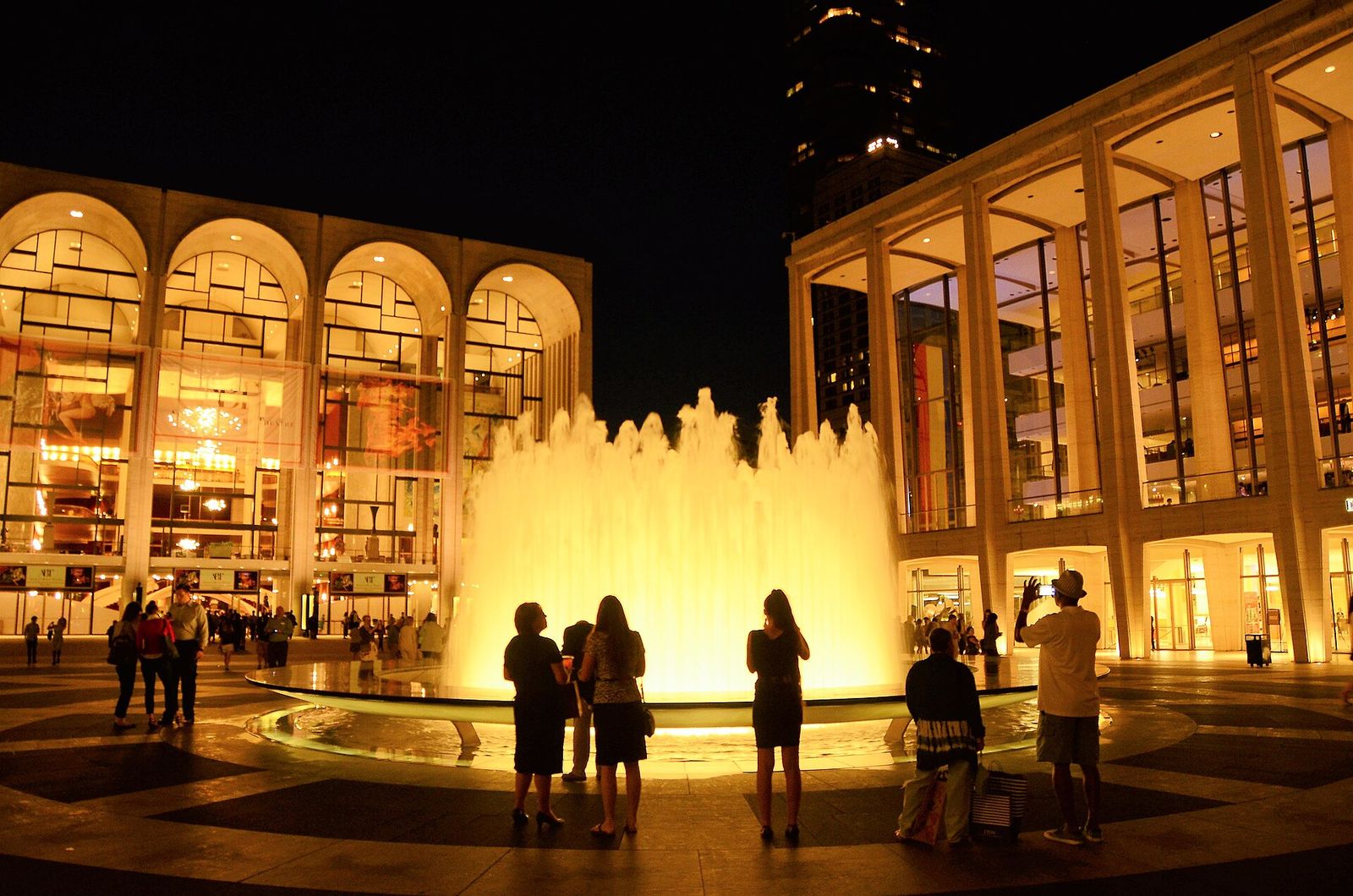 Lincoln Center Plaza fountain at night with the Metropolitan Opera House on the left, and the David Geffen Hall on the right, Metropolitan Opera Opening Night