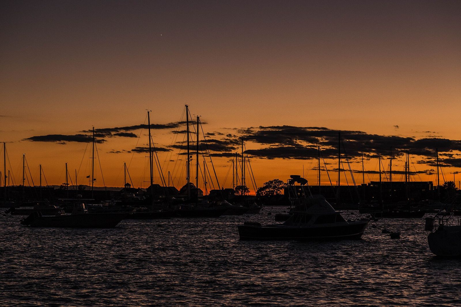 Evening twilight descends over sailboats in Newport harbor in September 2016, Newport International Boat Show