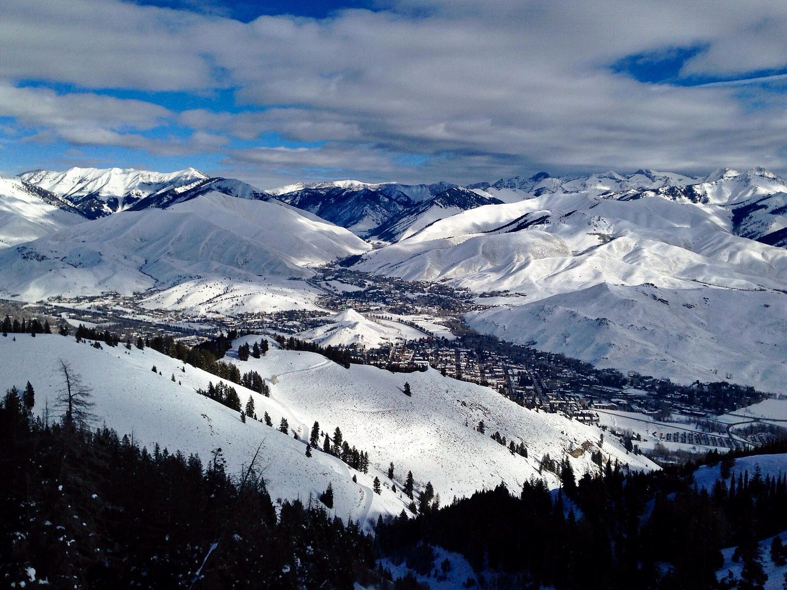 The Wood River Valley, Pioneer Mountains, Ketchum, and Sun Valley viewed from Bald Mountain in winter, Allen & Company Sun Valley Conference