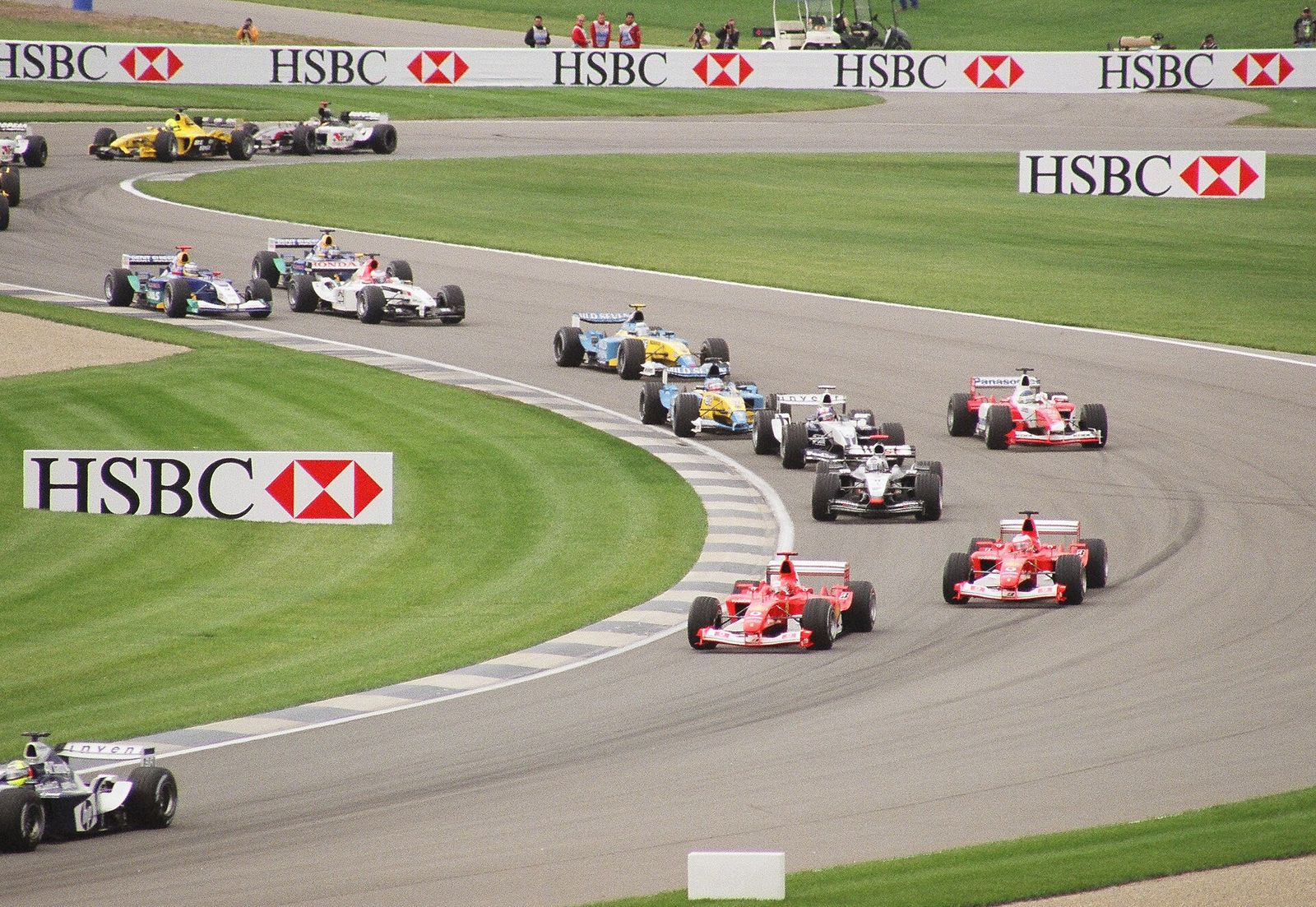 Formula One cars wind through the infield section of Indianapolis Motor Speedway at the 2003 United States Grand Prix