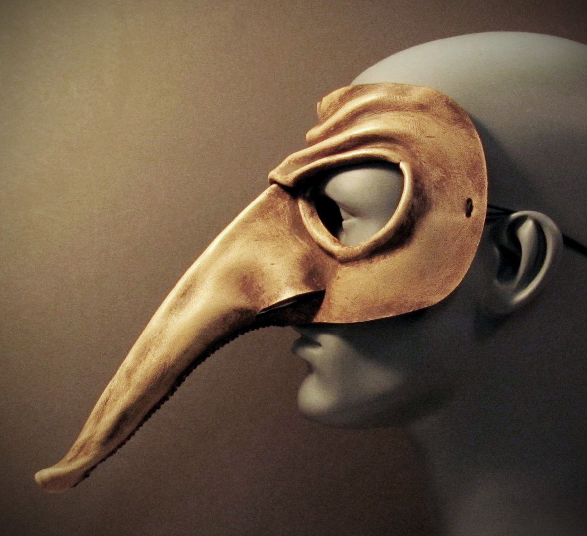 A leather version of a Zanni mask from the Italian Commedia dell'Arte, profile view, Carnival of Venice